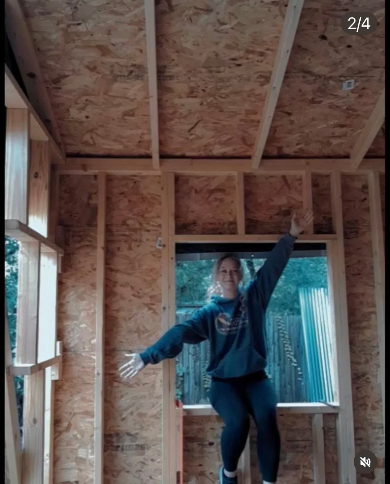 Family in the framed window opening — building it together