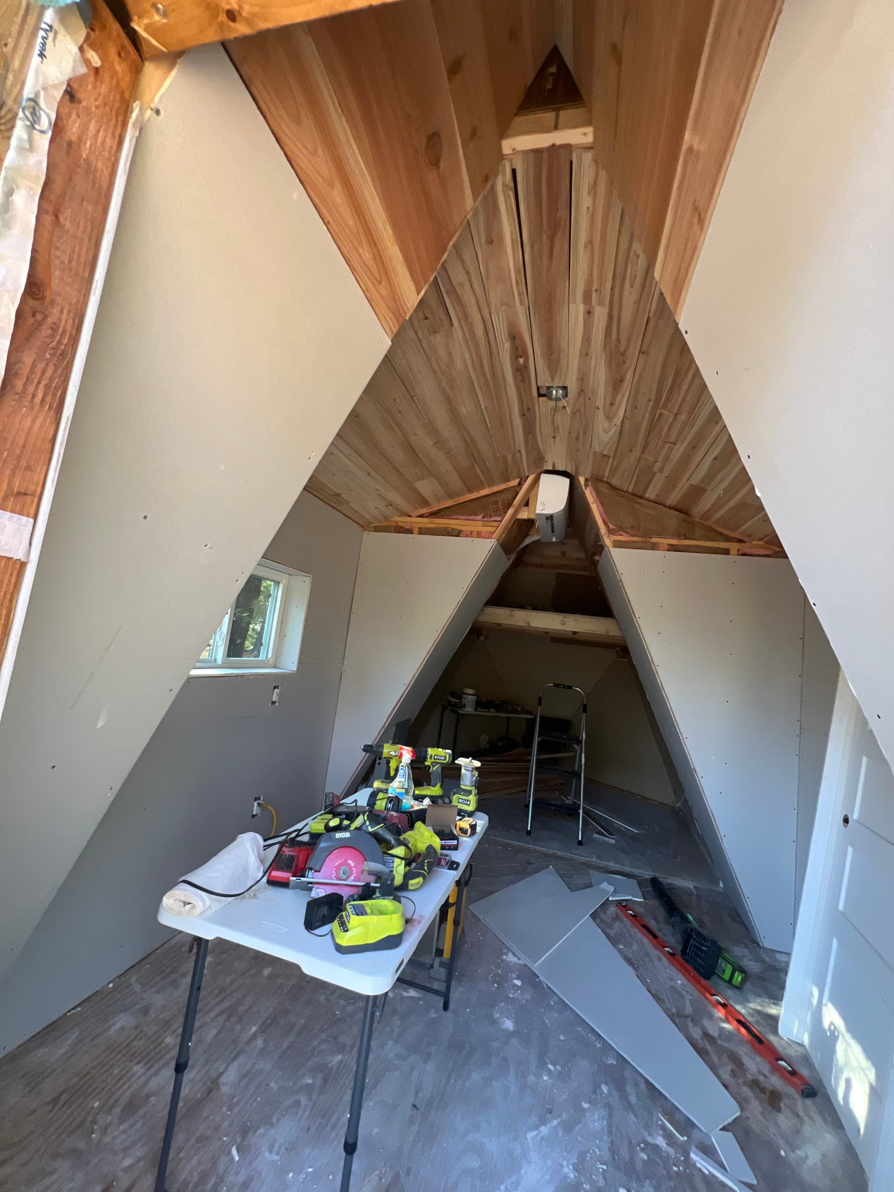 Interior — wood ceiling, mini-split, drywall in progress
