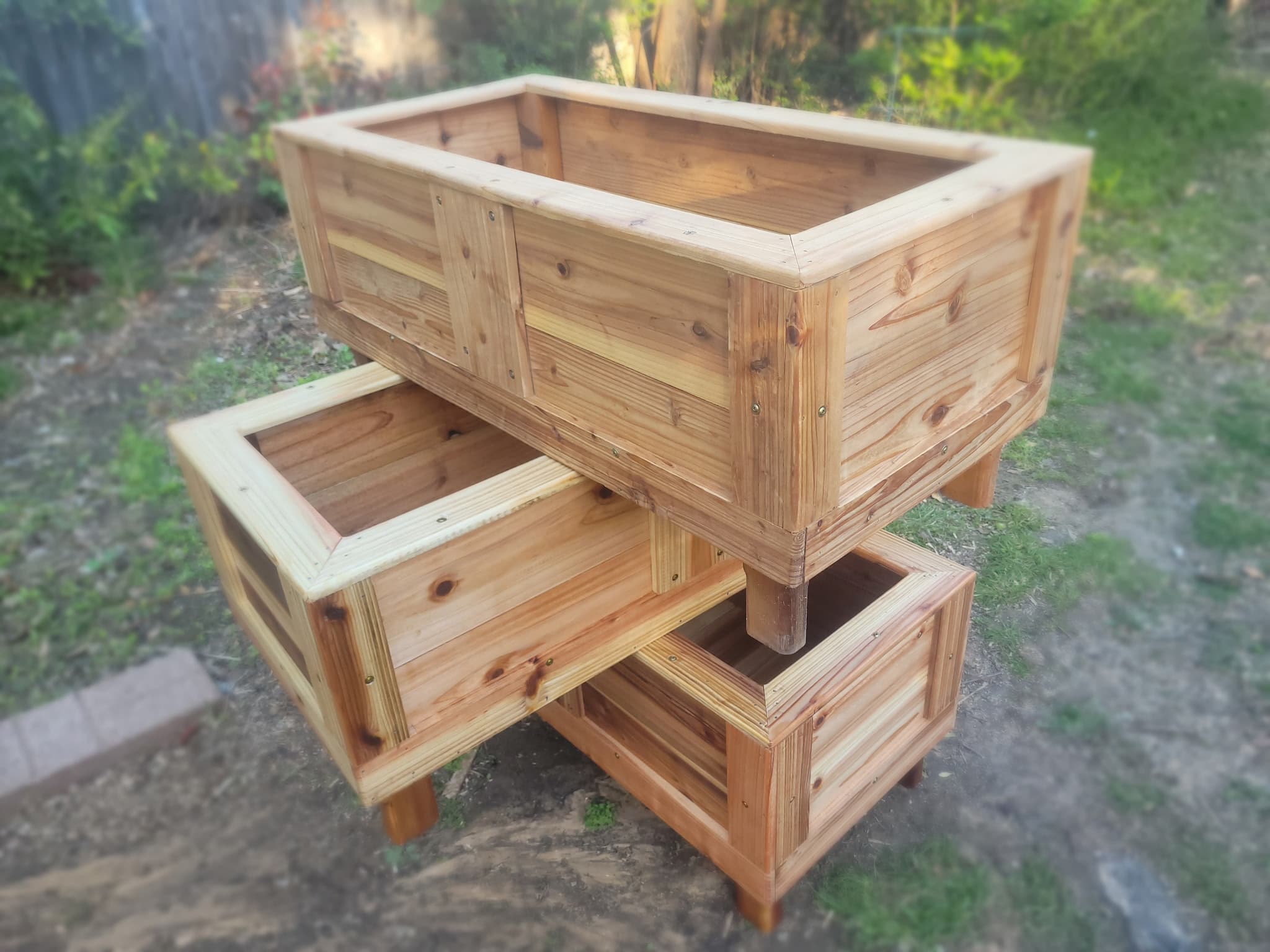 Stacked cedar planters in warm afternoon light