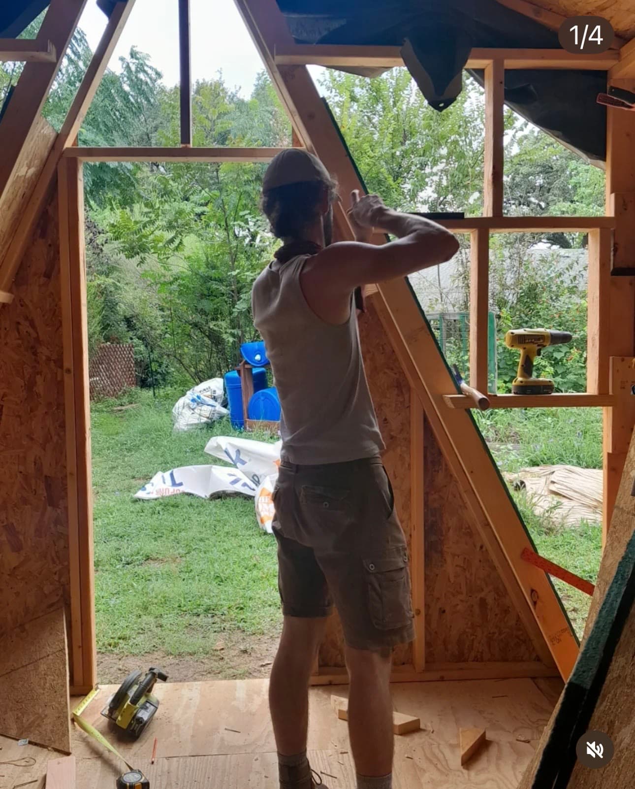 Sebastian at work on the upper level of the tiny house during construction